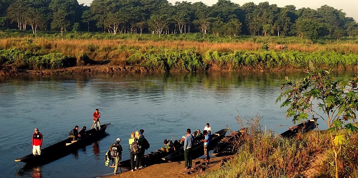 Dugout canoes setting out on the Rapti River in Chitwan National Park
