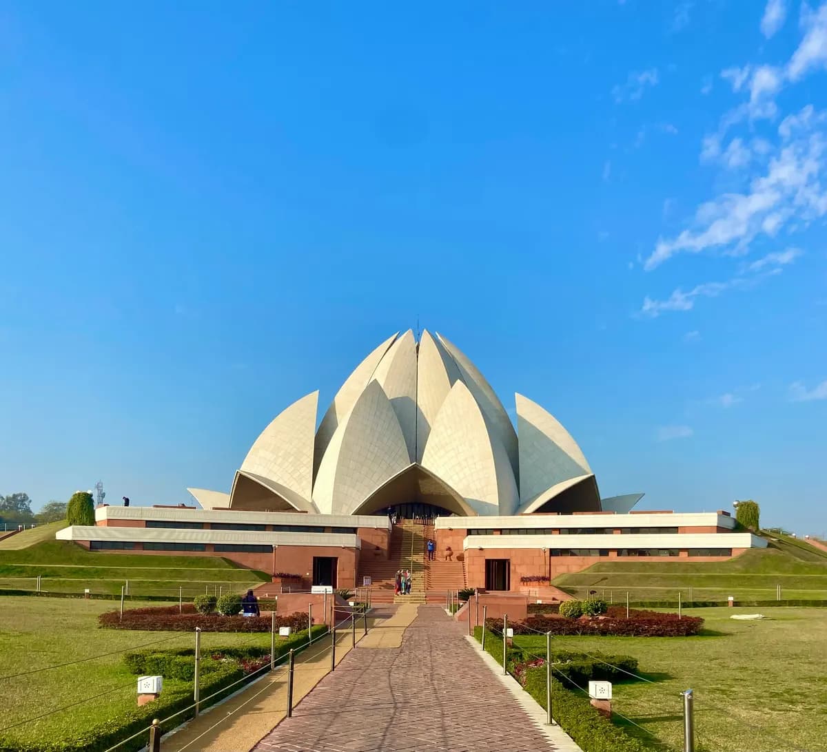 Lotus Temple, Delhi, under a clear blue sky