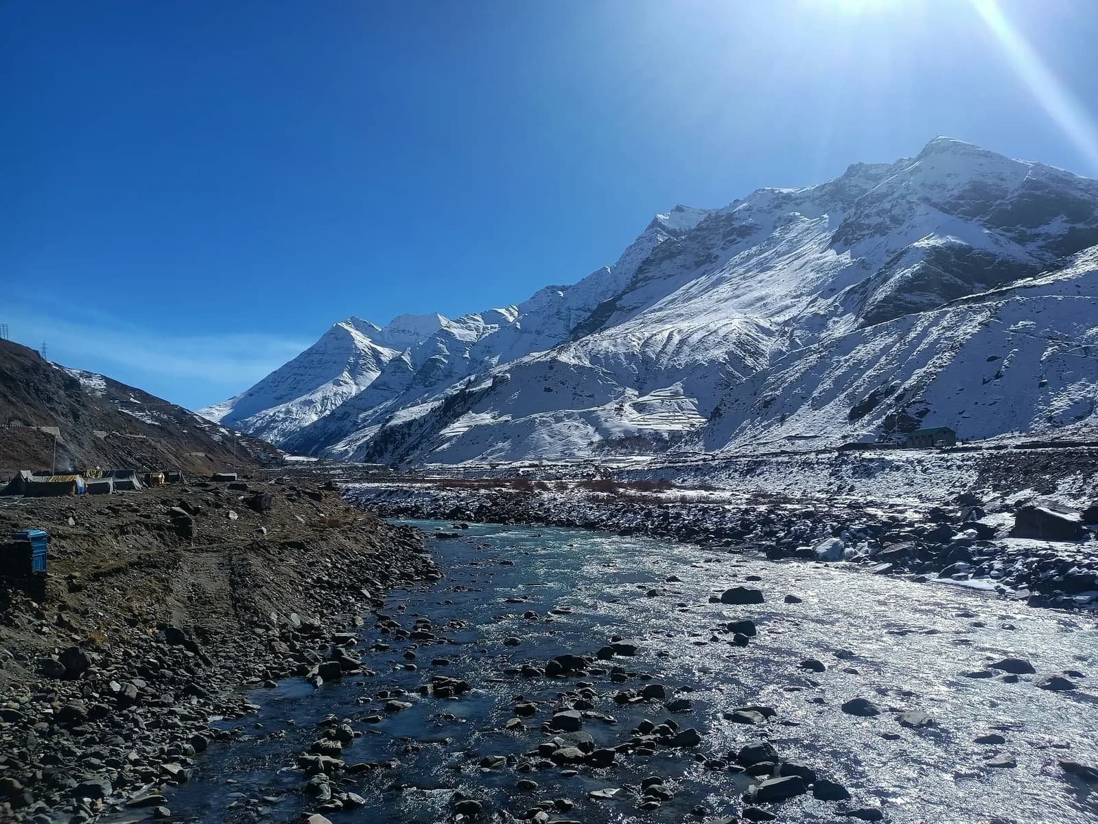 Snow-capped mountains and river valley near Manali