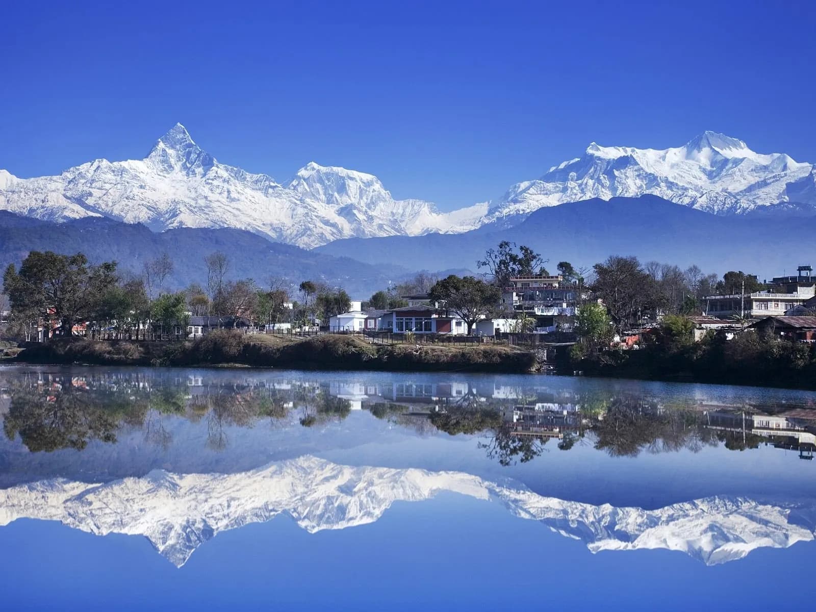Phewa Lake with the Annapurna range reflected in the still water