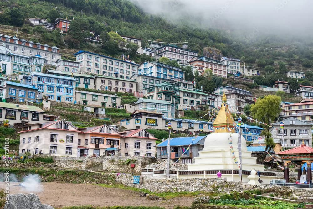 Namche Bazaar's terraced houses and stupa built into the hillside