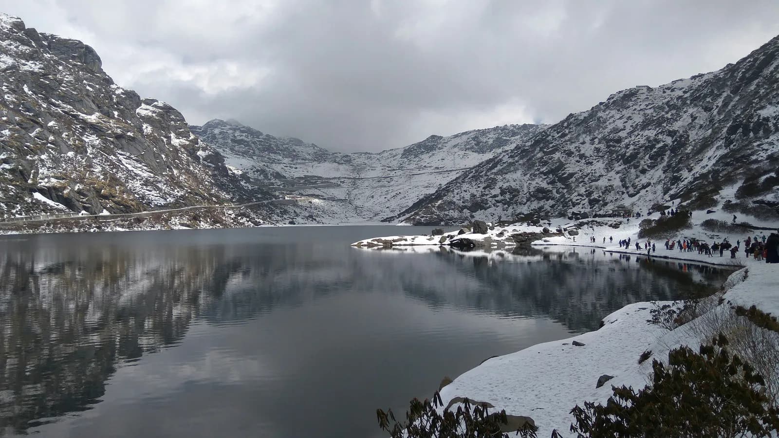 Tsomgo Lake surrounded by snow-covered mountains, Sikkim
